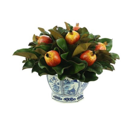 Pretty pomegranate and magnolia midsized arrangement in blue/white pierced planter