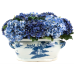 Beautiful blue hydrangea arrangement in elegant fishbowl